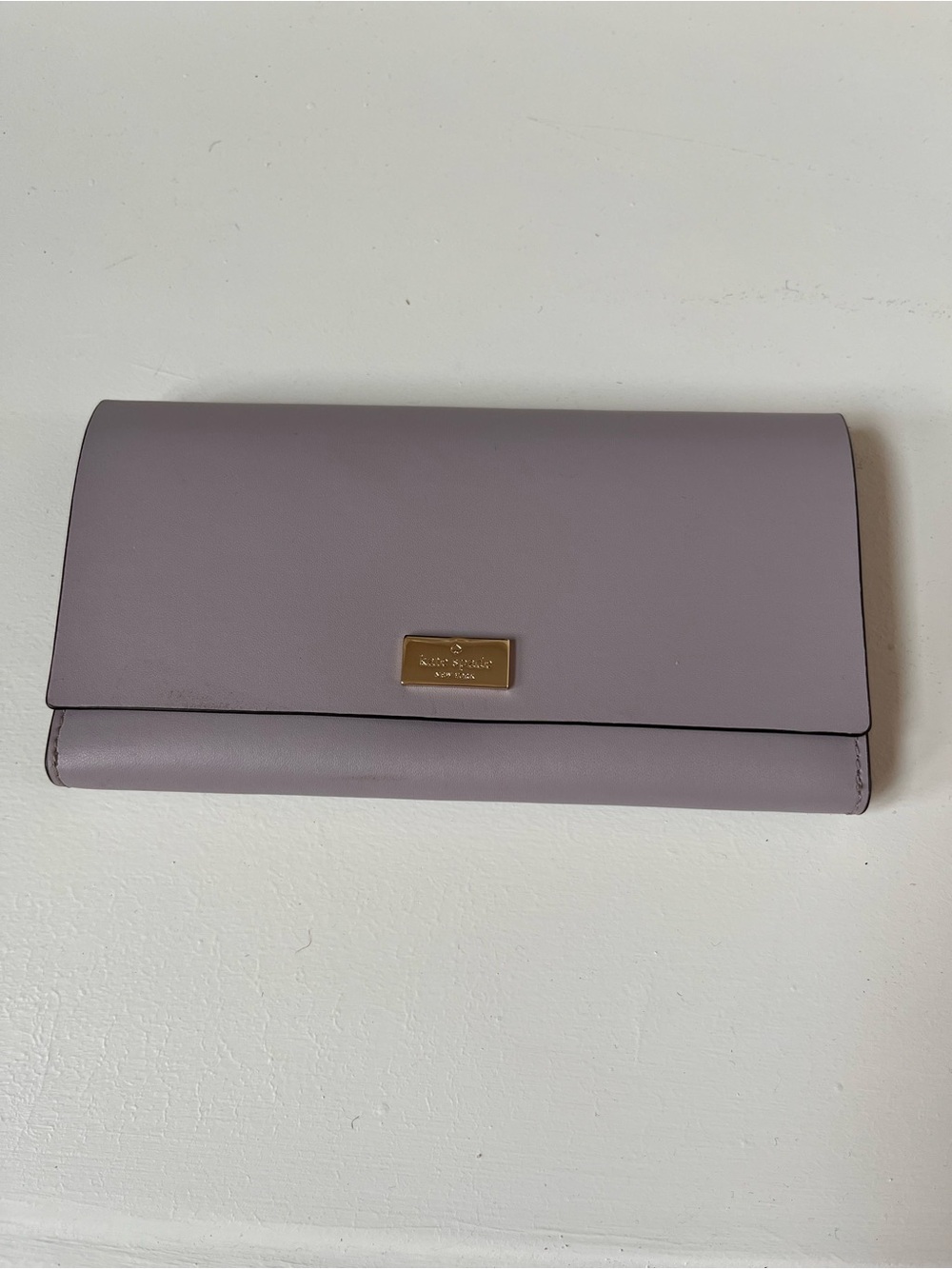 kate spade lavender leather flap wallet with gold plaque